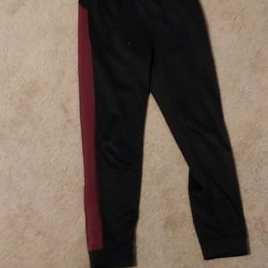 Black joggers with symmetrical red strype